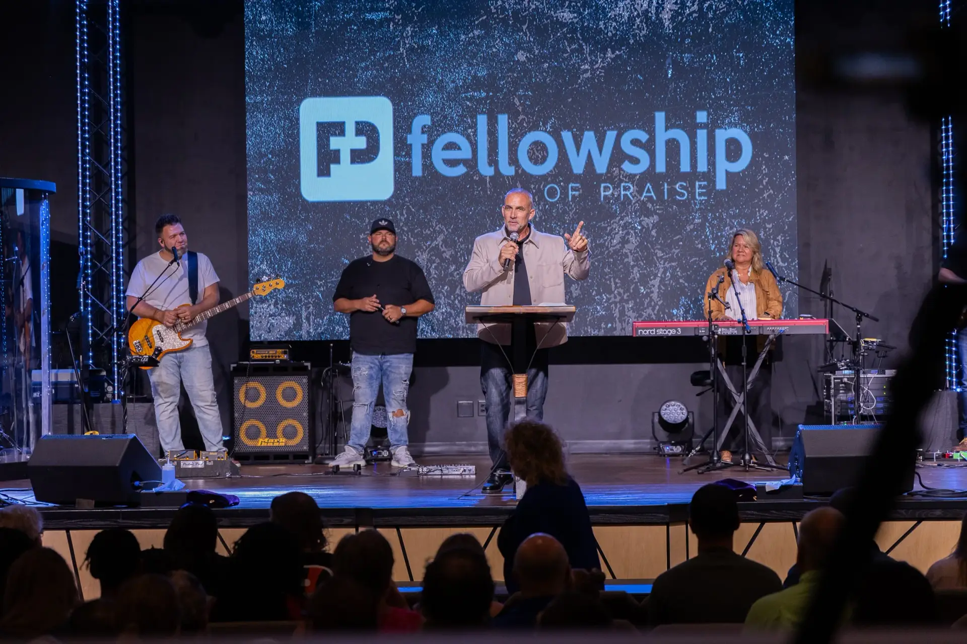 Church worship service with band and pastor using professional audio visual system at Fellowship of Praise in Clarksville Ohio