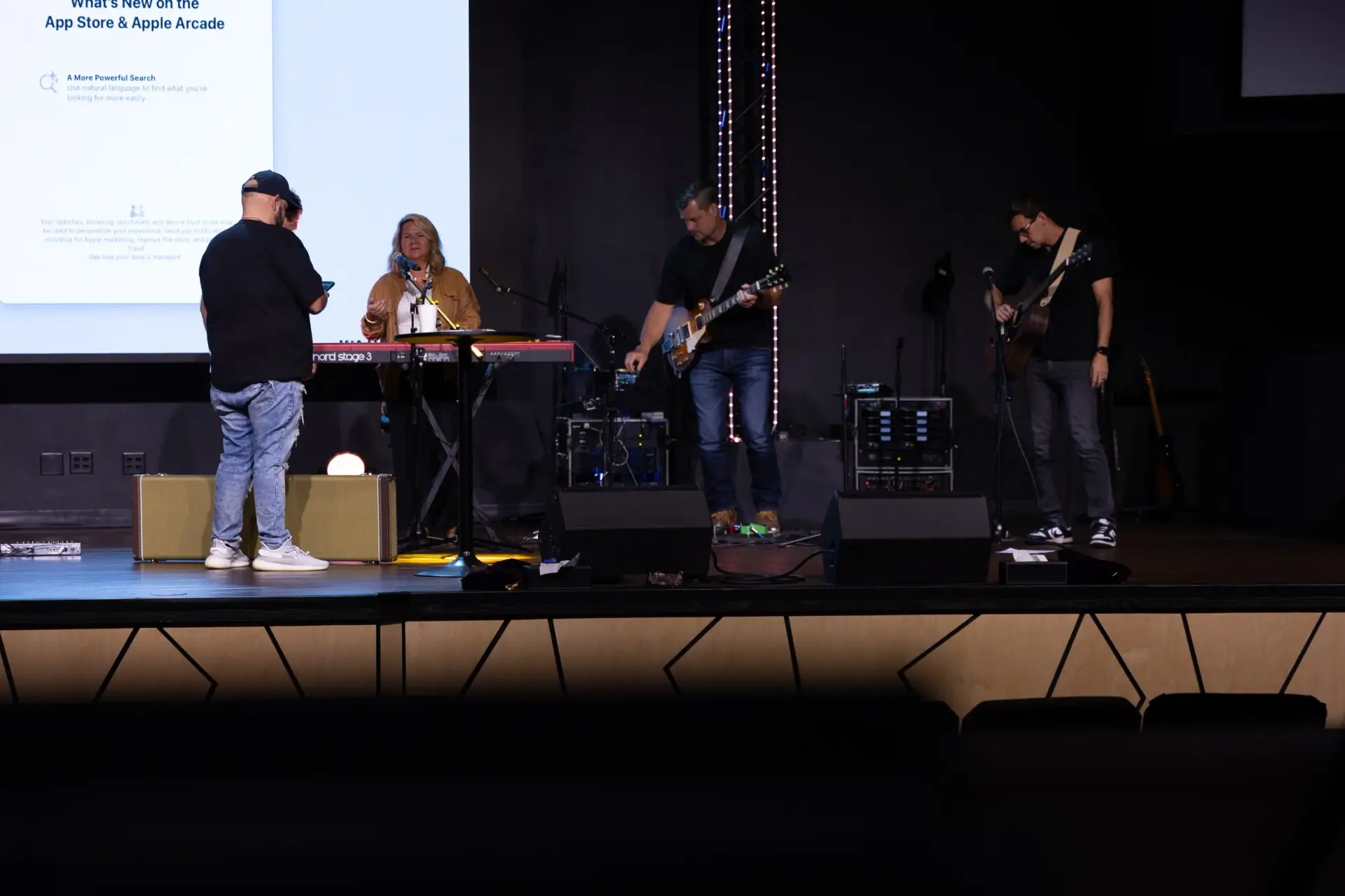 Church worship team performing on stage using the new AVL system installed at Fellowship of Praise in Clarksville Ohio