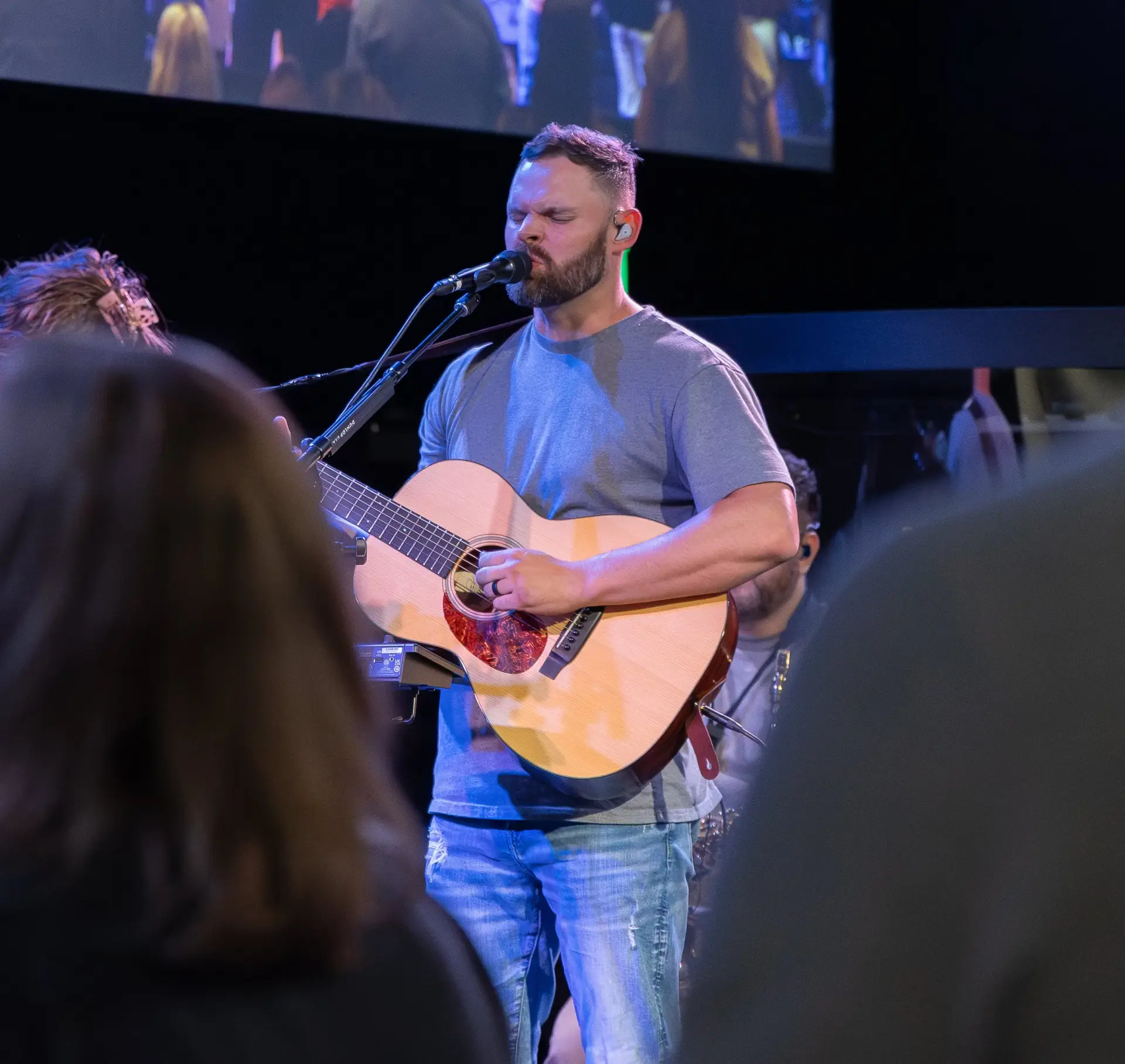 Worship singer performing at The Homestead in Mobile Alabama during a live church service