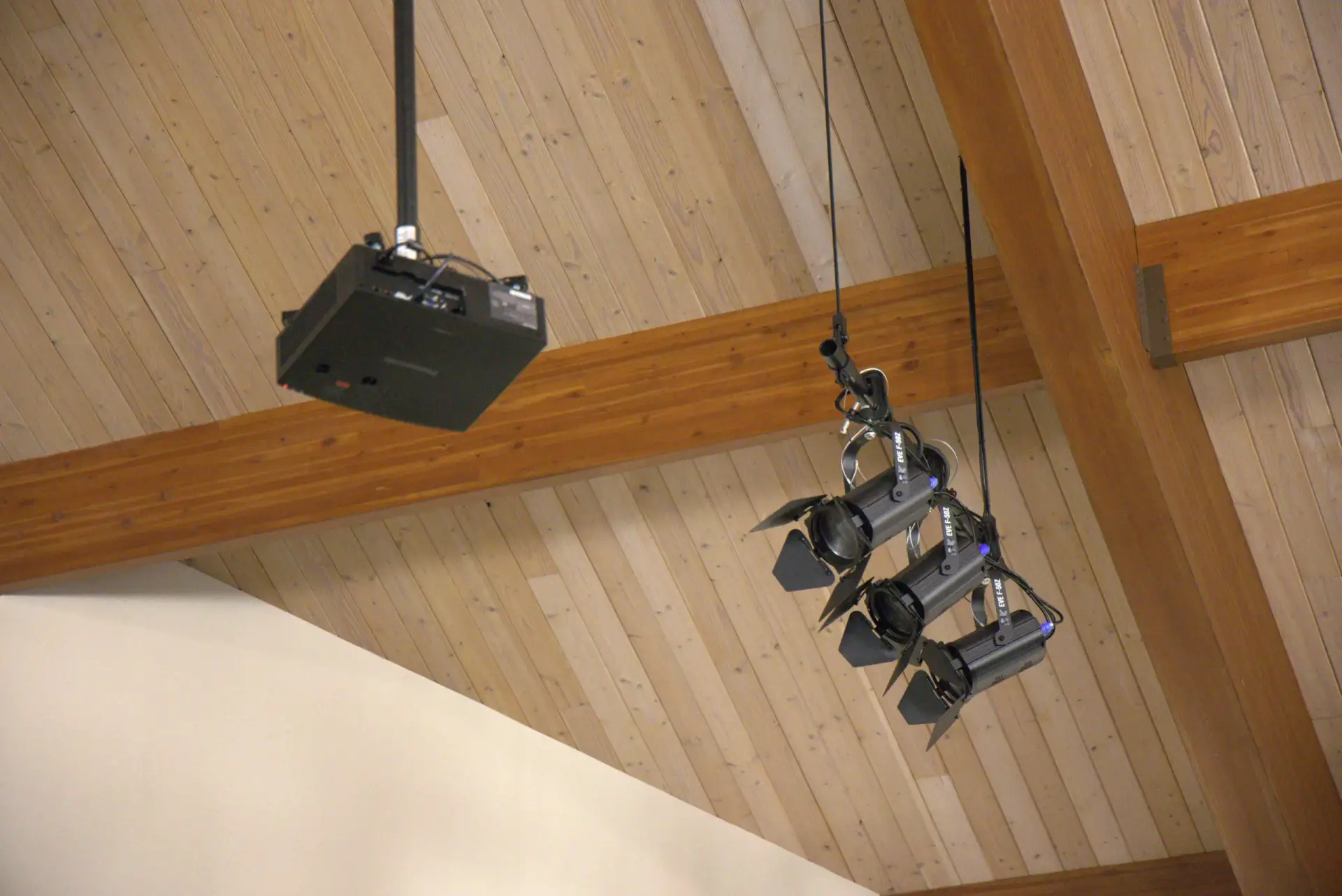Panasonic projector and Chauvet stage lighting fixtures installed in a church sanctuary