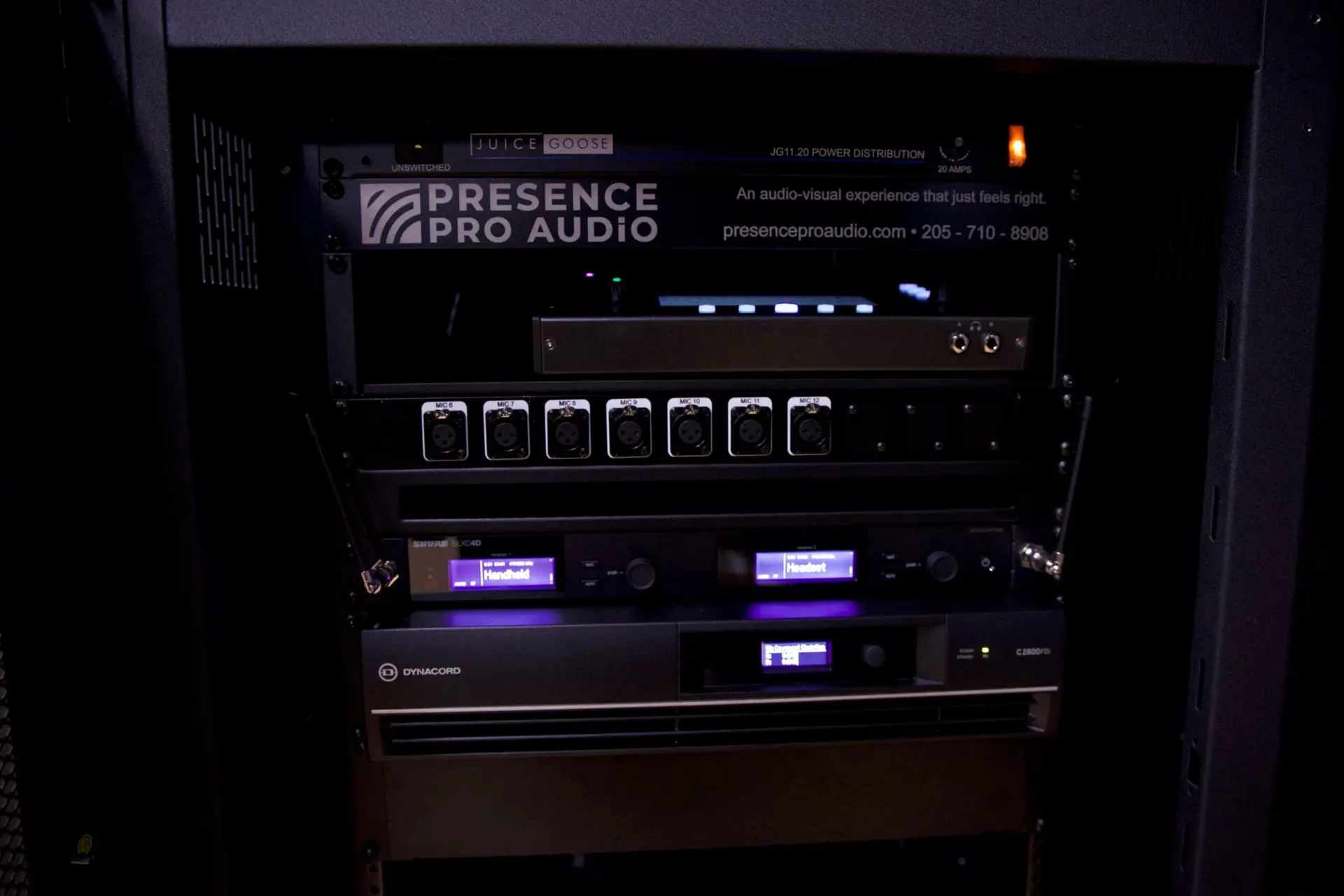 Close-up of custom Presence Pro Audio AV rack with Dynacord amplifier and Shure wireless systems