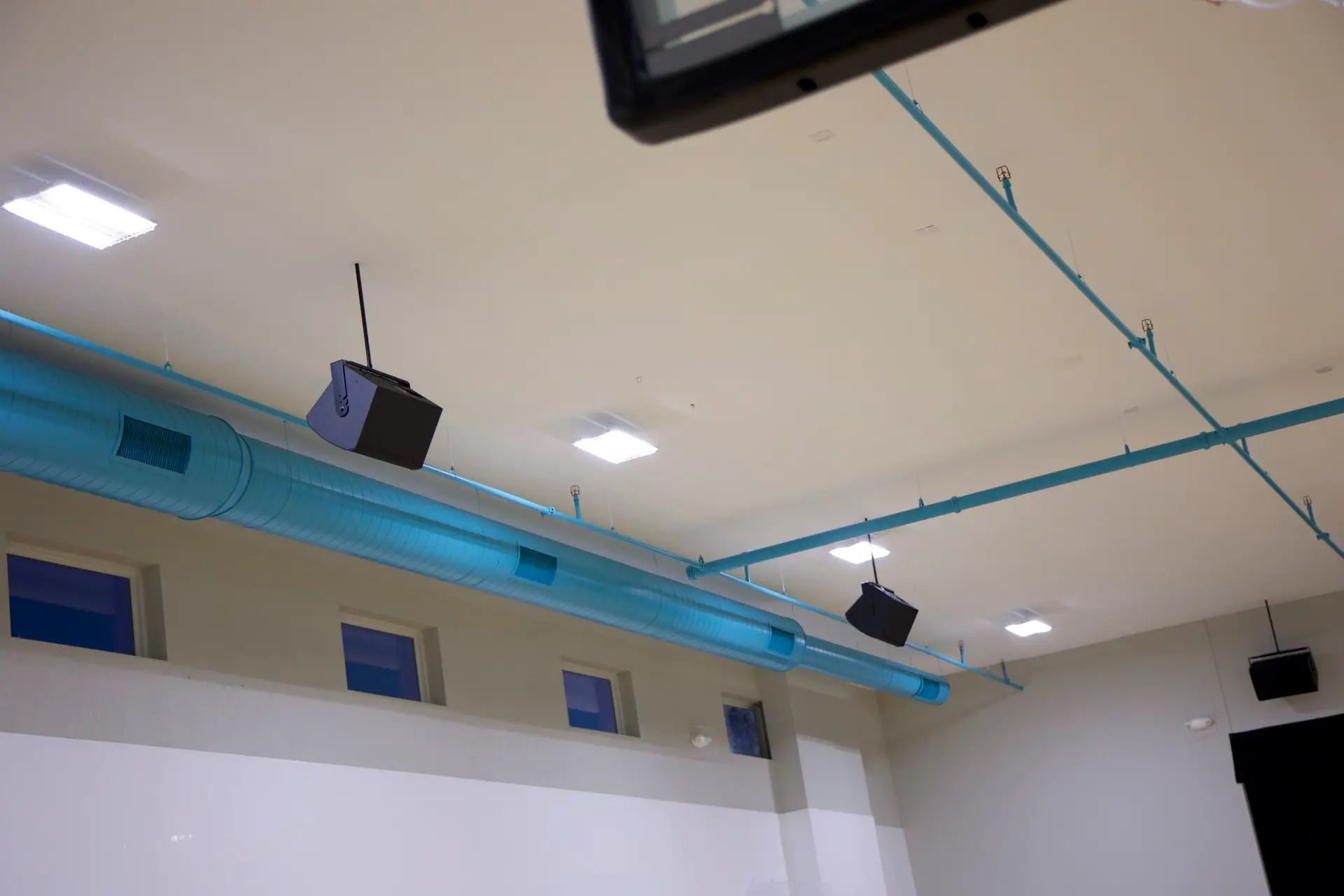 Full wide shot of Covenant Christian School gymnasium auditorium and installed audio system