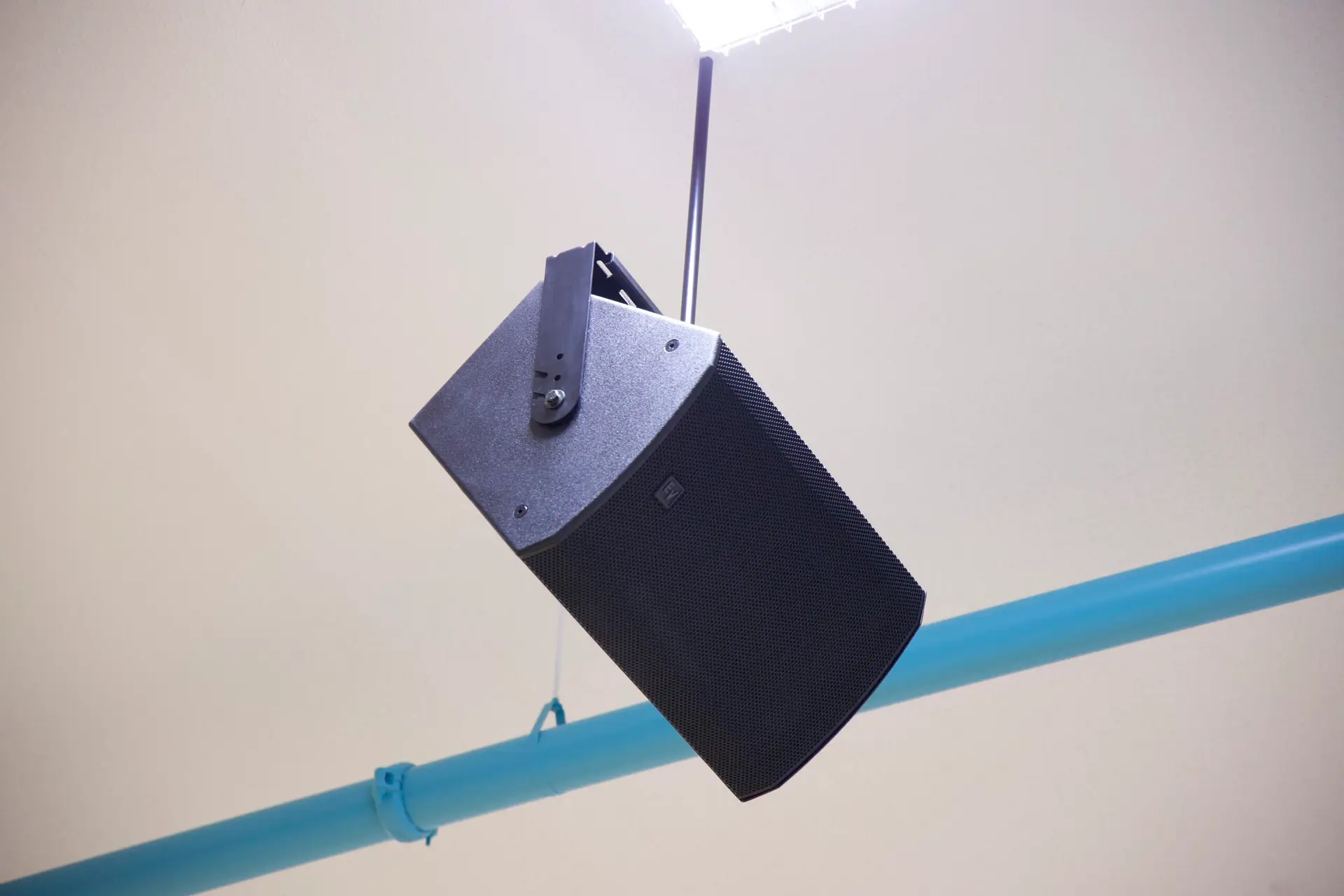 Suspended EV-C speaker system providing audio coverage throughout school gymnasium