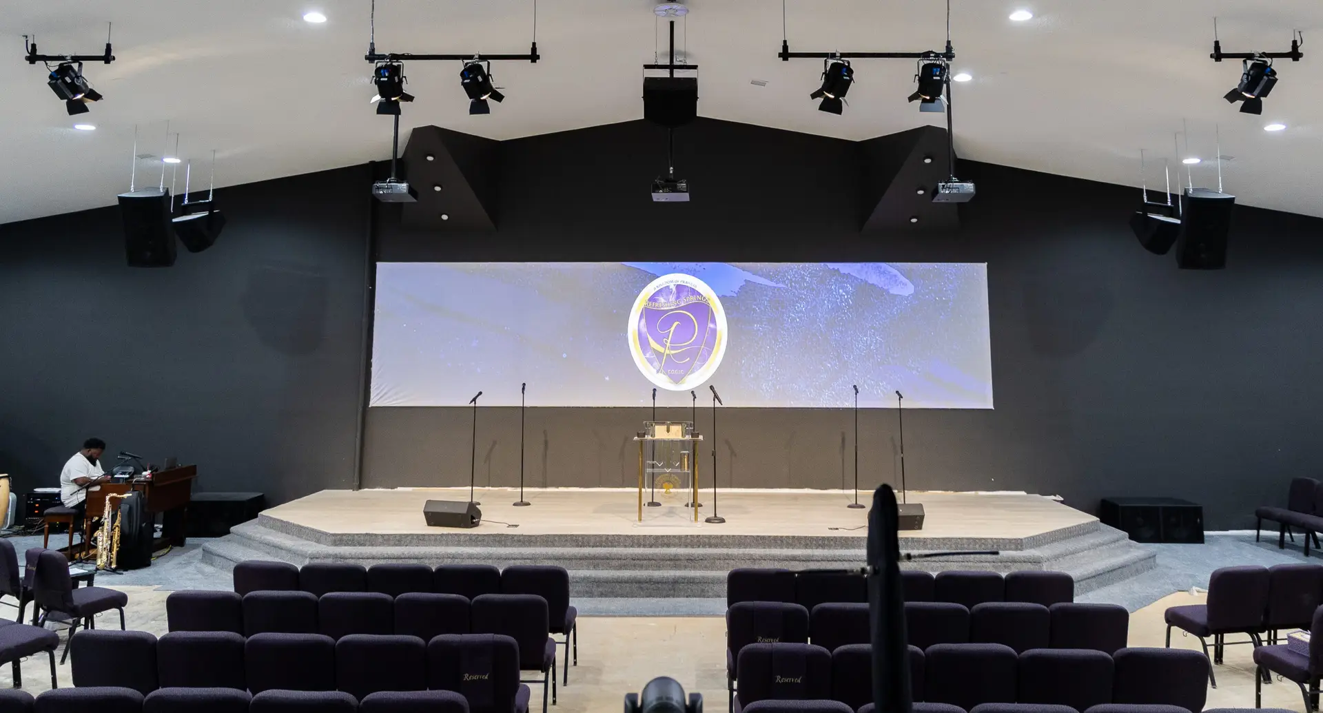 Complete church audio video and lighting installation with projection lighting and speaker system at Refreshing Springs Church Kokomo Indiana